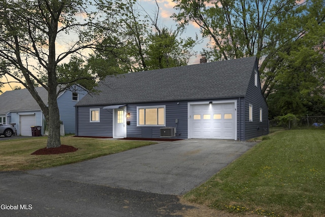 789 Troy Schenectady Rd, Colonie, NY 12110 - view of front facade featuring a chimney, a lawn, driveway, roof with shingles, and an attached garage