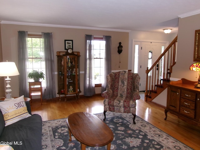 22 Frances Ln, Bethlehem, NY 12203 - living room featuring light wood-type flooring, stairs, and crown molding