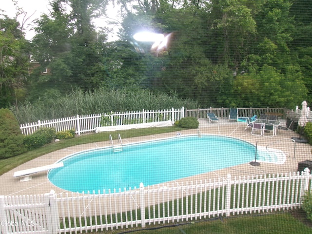 22 Frances Ln, Bethlehem, NY 12203 - view of swimming pool with a diving board and a patio area