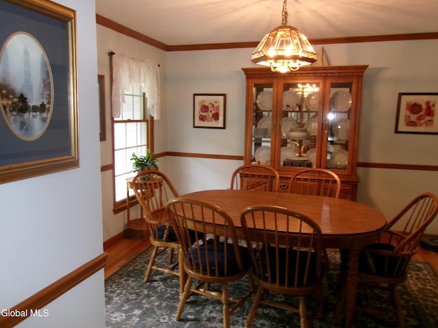 22 Frances Ln, Bethlehem, NY 12203 - dining room with a chandelier, wood finished floors, and crown molding