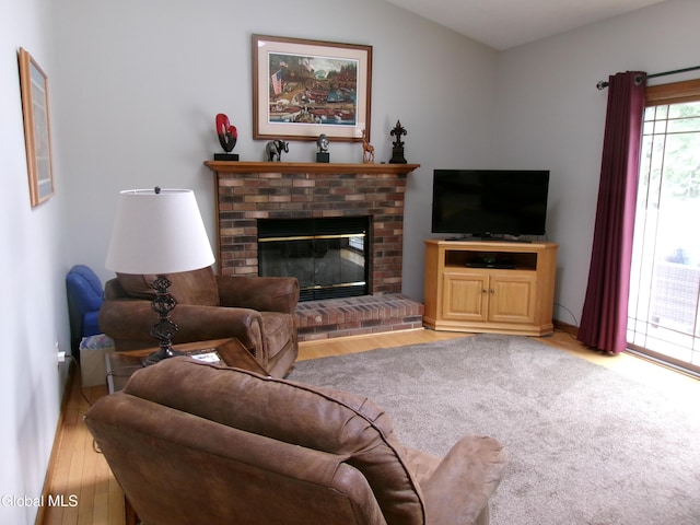 22 Frances Ln, Bethlehem, NY 12203 - living room with a fireplace and light wood-type flooring
