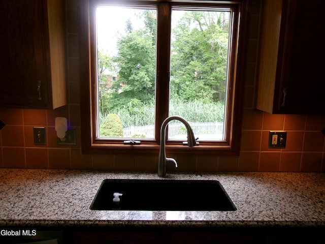 22 Frances Ln, Bethlehem, NY 12203 - kitchen featuring tasteful backsplash and light stone counters