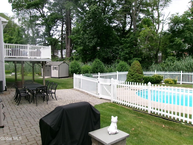 22 Frances Ln, Bethlehem, NY 12203 - view of pool featuring a shed, a patio, outdoor dining area, a fenced backyard, and grilling area