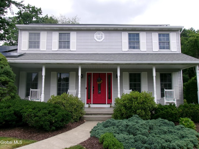 22 Frances Ln, Bethlehem, NY 12203 - view of front facade featuring covered porch and a shingled roof