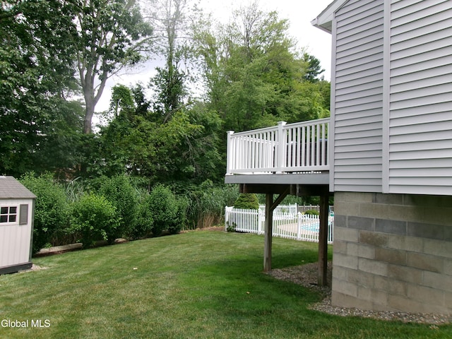 22 Frances Ln, Bethlehem, NY 12203 - view of yard featuring a wooden deck and a storage unit