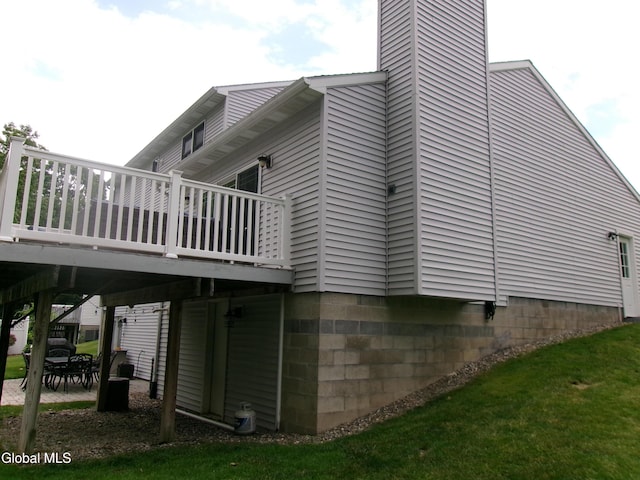 22 Frances Ln, Bethlehem, NY 12203 - view of side of home with a wooden deck, a chimney, and a patio area