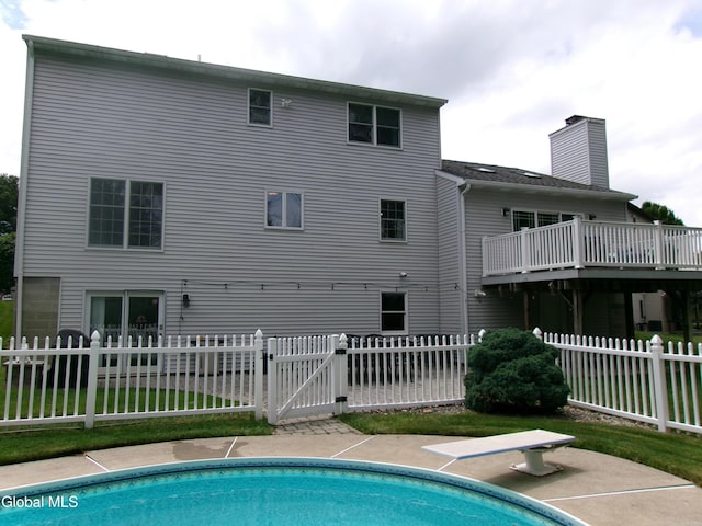22 Frances Ln, Bethlehem, NY 12203 - back of property featuring a gate and a chimney
