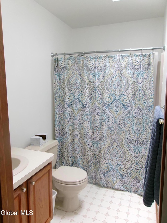 22 Frances Ln, Bethlehem, NY 12203 - full bathroom featuring vanity, curtained shower, and tile patterned floors