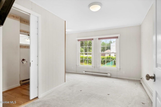 7 Swan St, Hudson Falls, NY 12839 - unfurnished bedroom with a baseboard heating unit, baseboard heating, and carpet flooring