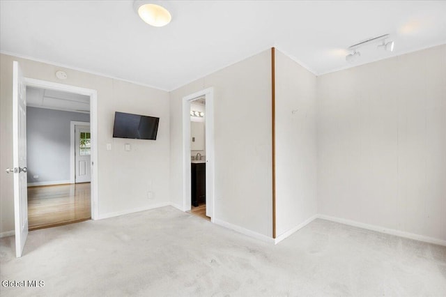 7 Swan St, Hudson Falls, NY 12839 - empty room with carpet flooring, crown molding, track lighting, and a smoke detector