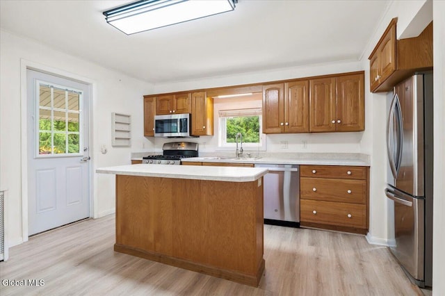 7 Swan St, Hudson Falls, NY 12839 - kitchen with appliances with stainless steel finishes, light countertops, light wood finished floors, and brown cabinetry