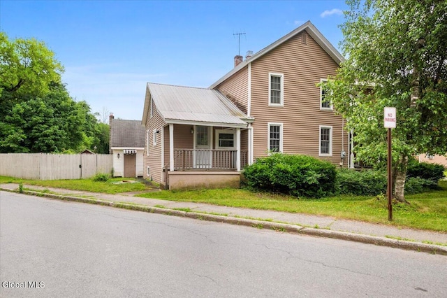 7 Swan St, Hudson Falls, NY 12839 - view of front facade featuring covered porch and a chimney