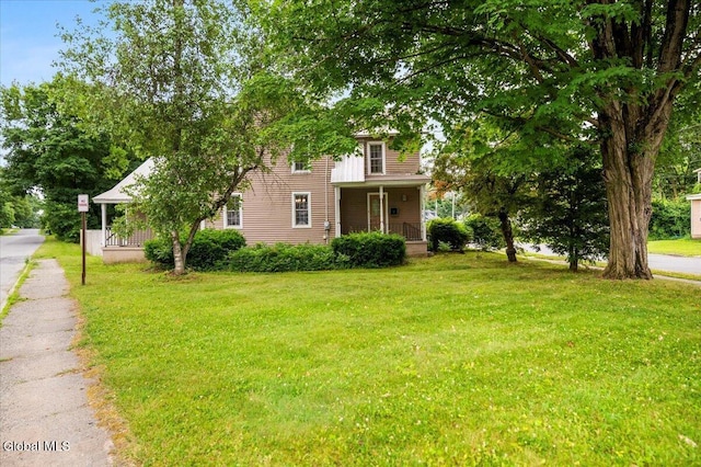7 Swan St, Hudson Falls, NY 12839 - view of front facade with a front lawn and a porch