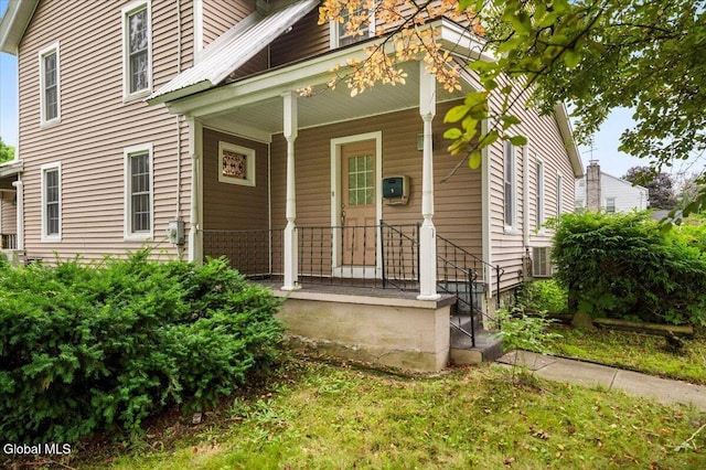 7 Swan St, Hudson Falls, NY 12839 - doorway to property featuring covered porch