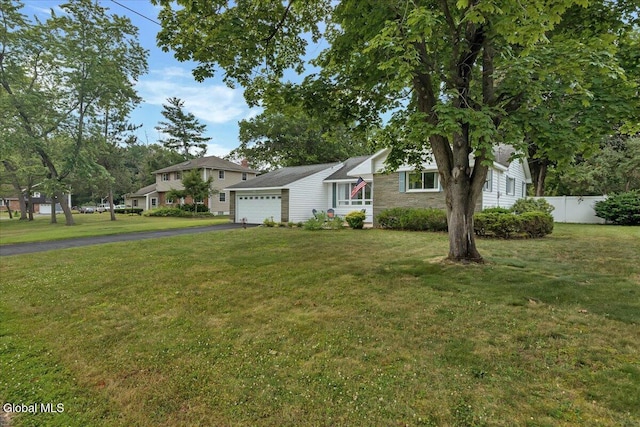611 Via Ponderosa, Schenectady, NY 12303 - view of front of house with a garage and asphalt driveway