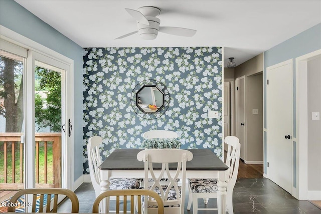 611 Via Ponderosa, Schenectady, NY 12303 - dining area with wallpapered walls, an accent wall, and ceiling fan