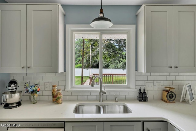 611 Via Ponderosa, Schenectady, NY 12303 - kitchen featuring dishwasher, light countertops, and tasteful backsplash