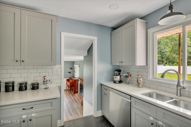611 Via Ponderosa, Schenectady, NY 12303 - kitchen with dishwashing machine, healthy amount of natural light, light countertops, and tasteful backsplash