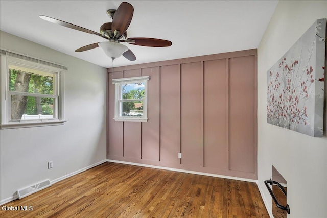 611 Via Ponderosa, Schenectady, NY 12303 - unfurnished bedroom with multiple windows, wood finished floors, and a ceiling fan