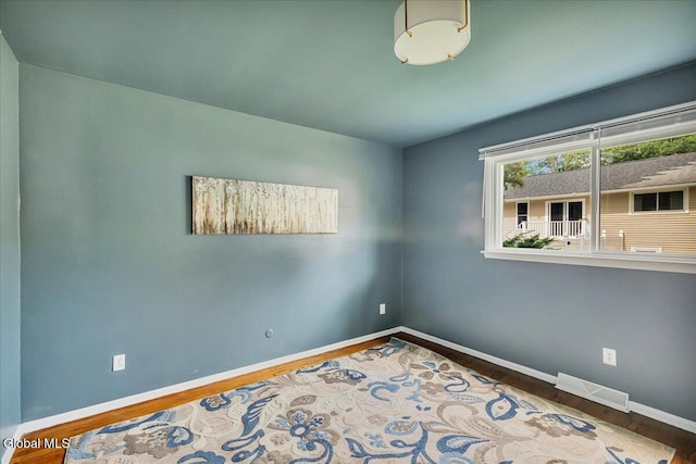 611 Via Ponderosa, Schenectady, NY 12303 - empty room with baseboards and wood finished floors