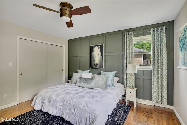 611 Via Ponderosa, Schenectady, NY 12303 - bedroom with wood finished floors, a closet, a ceiling fan, and a decorative wall