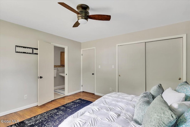 611 Via Ponderosa, Schenectady, NY 12303 - bedroom featuring wood finished floors, a closet, connected bathroom, and a ceiling fan