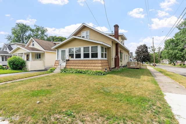 2780 Campbell Ave, Schenectady, NY 12306 - bungalow-style house featuring a front yard and a chimney