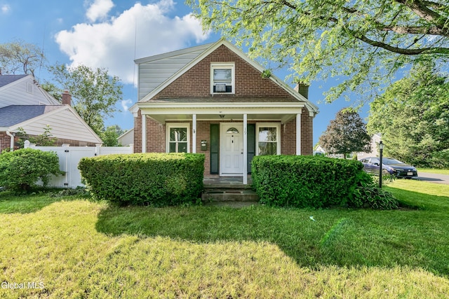 19 Elmhurst Ave, Colonie, NY 12205 - bungalow with brick siding and covered porch