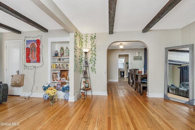 19 Elmhurst Ave, Colonie, NY 12205 - entrance foyer featuring arched walkways, beam ceiling, and light wood-style floors