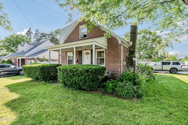 19 Elmhurst Ave, Colonie, NY 12205 - view of front of property featuring brick siding, a front lawn, a chimney, and a porch
