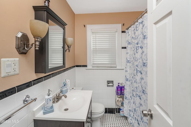19 Elmhurst Ave, Colonie, NY 12205 - full bathroom featuring vanity, tile walls, wainscoting, and curtained shower