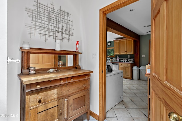5761 Lake Rd, Galway, NY 12074 - corridor with light tile patterned flooring and independent washer and dryer