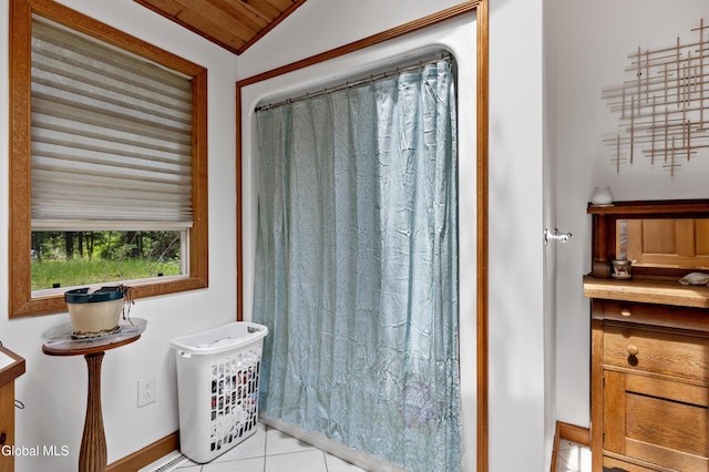 5761 Lake Rd, Galway, NY 12074 - full bath featuring tile patterned flooring, vaulted ceiling, and curtained shower