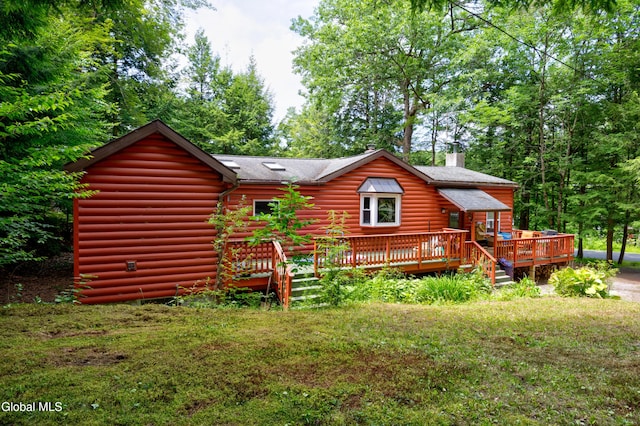 5761 Lake Rd, Galway, NY 12074 - back of house with a chimney, a wooden deck, roof with shingles, and a yard