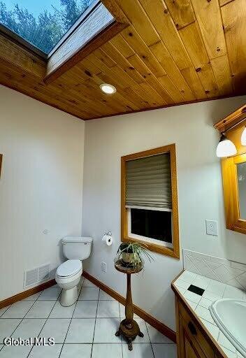 5761 Lake Rd, Galway, NY 12074 - bathroom featuring a skylight, wood ceiling, and vanity