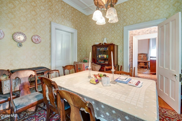 61 Mohawk St, Fort Plain, NY 13339 - dining area with a chandelier, crown molding, wallpapered walls, and wood finished floors