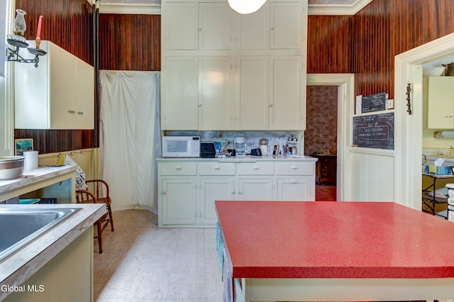 61 Mohawk St, Fort Plain, NY 13339 - kitchen featuring white microwave, white cabinets, light flooring, and light countertops