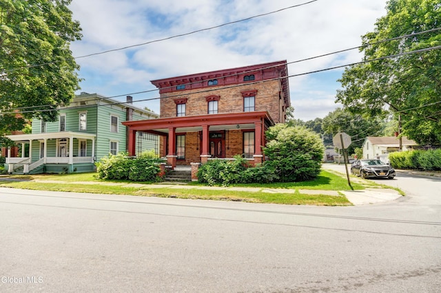 61 Mohawk St, Fort Plain, NY 13339 - italianate home featuring covered porch and brick siding