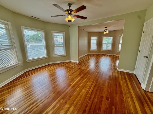 471-473 Harrison Ave, Schenectady, NY 12306 - empty room featuring wood finished floors, healthy amount of natural light, and ceiling fan
