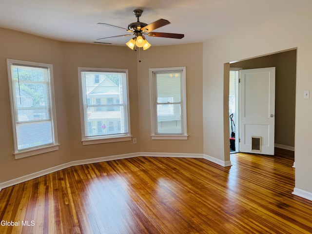 471-473 Harrison Ave, Schenectady, NY 12306 - empty room featuring healthy amount of natural light, wood finished floors, and ceiling fan