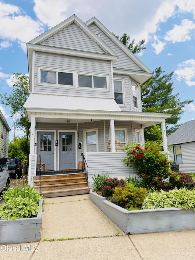471-473 Harrison Ave, Schenectady, NY 12306 - view of front of home featuring covered porch and a metal roof