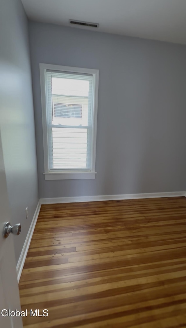 471-473 Harrison Ave, Schenectady, NY 12306 - empty room featuring wood finished floors and baseboards