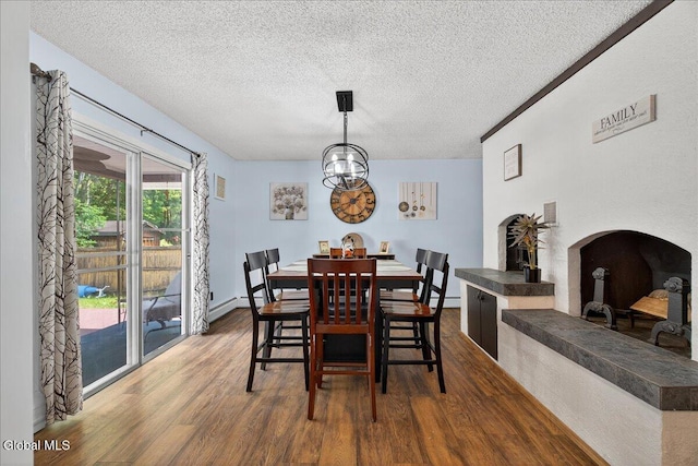 10 Heather Ln, Johnstown, NY 12078 - dining area featuring wood finished floors, a textured ceiling, and a chandelier