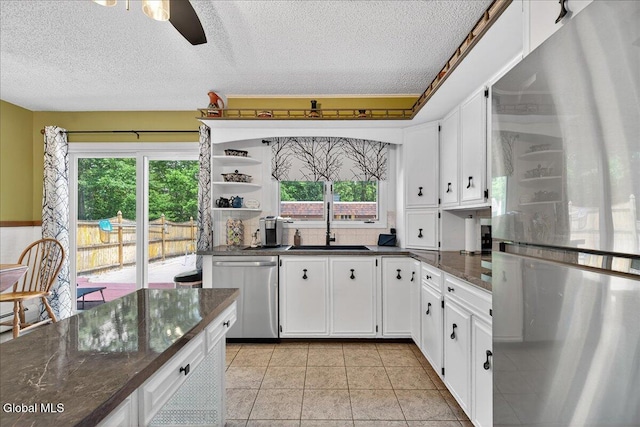 10 Heather Ln, Johnstown, NY 12078 - kitchen with stainless steel appliances, a textured ceiling, healthy amount of natural light, open shelves, and white cabinetry