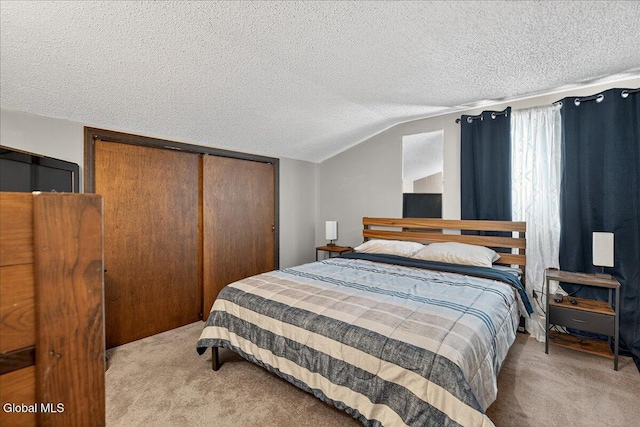 10 Heather Ln, Johnstown, NY 12078 - carpeted bedroom featuring a textured ceiling, a closet, and vaulted ceiling