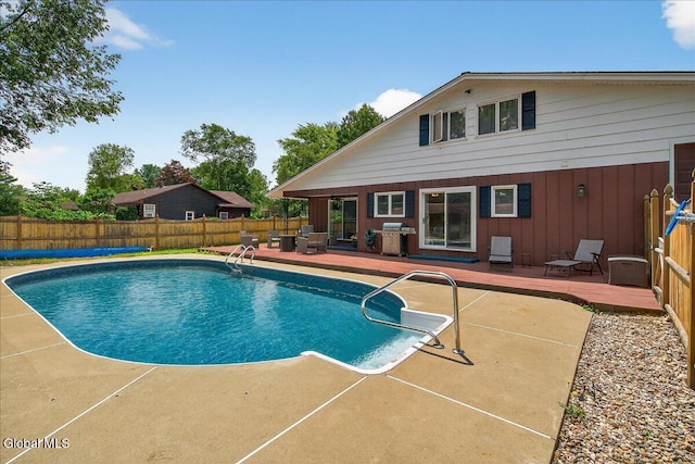 10 Heather Ln, Johnstown, NY 12078 - view of swimming pool with a wooden deck, a fenced backyard, grilling area, and a patio area