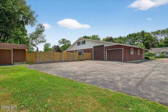 10 Heather Ln, Johnstown, NY 12078 - view of side of home with an outdoor structure and a garage