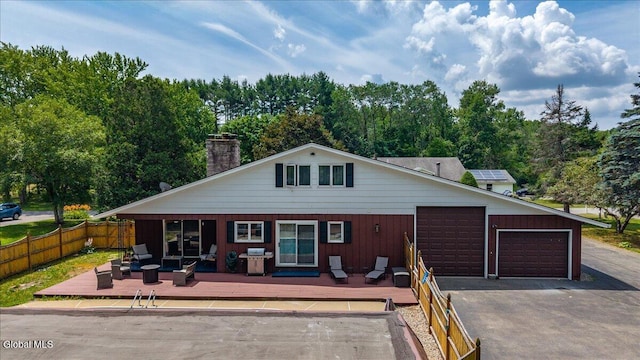 10 Heather Ln, Johnstown, NY 12078 - view of front of home with a deck, a chimney, and an outdoor living space