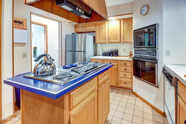 5 Wendfair Ter, Colonie, NY 12205 - kitchen featuring appliances with stainless steel finishes, extractor fan, light tile patterned floors, light countertops, and a center island