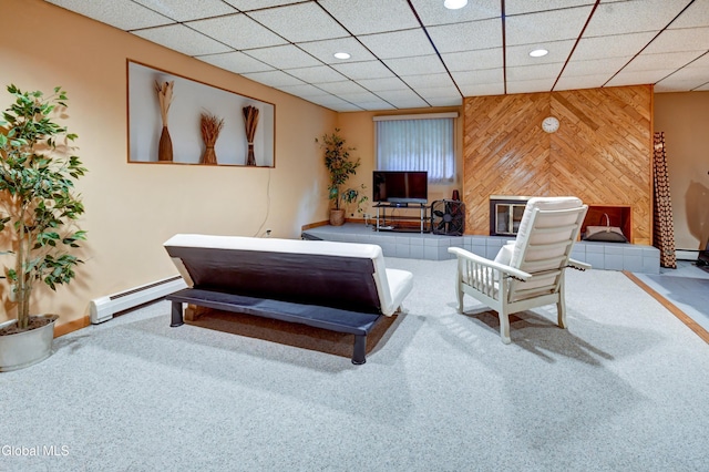 5 Wendfair Ter, Colonie, NY 12205 - carpeted living area featuring wood walls, recessed lighting, a paneled ceiling, and a baseboard radiator